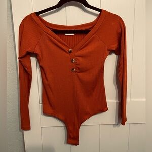 Burnt orange long sleeve bodysuit